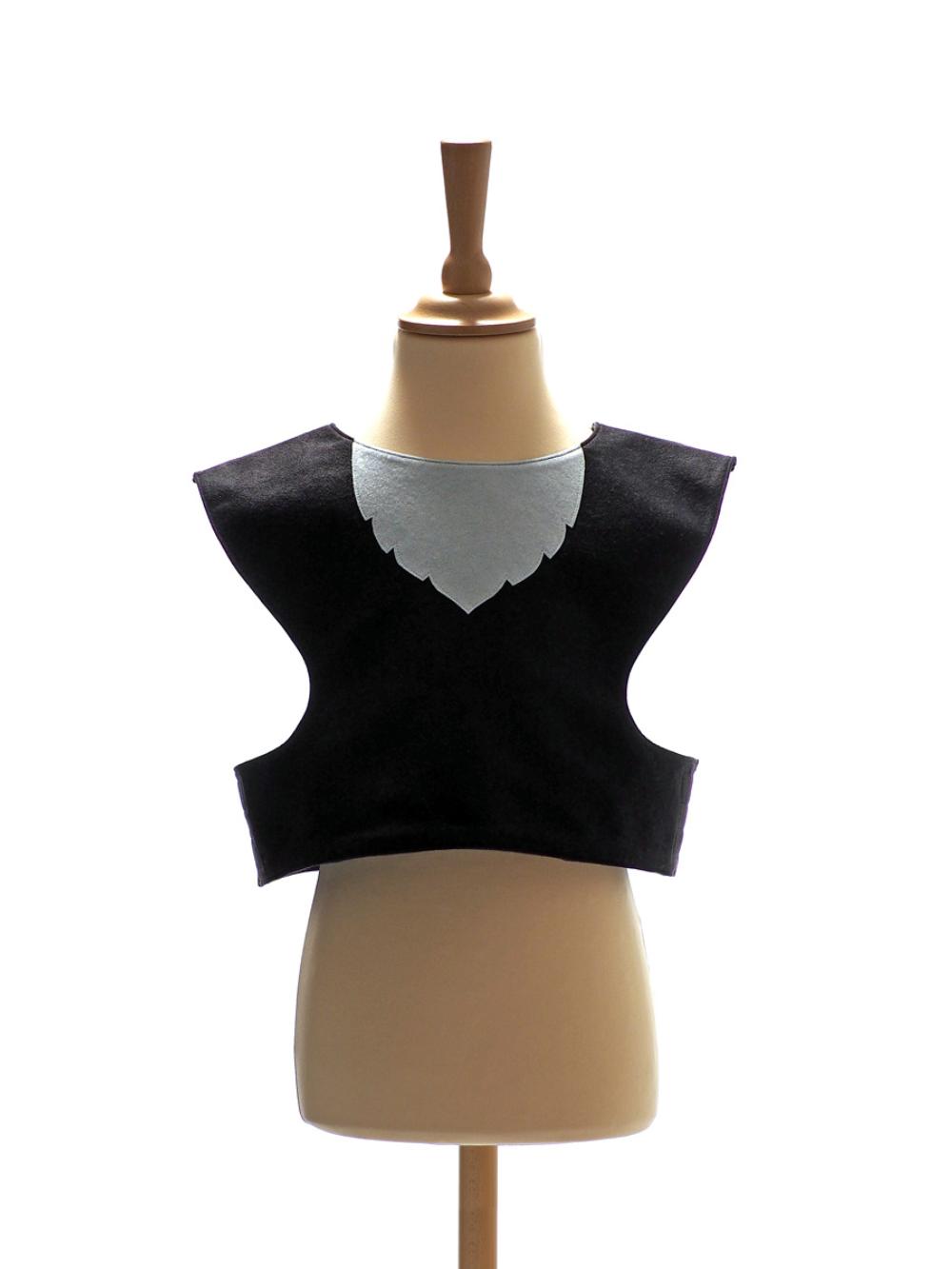 Front view of black cat tabard on a stand against a plain white background.