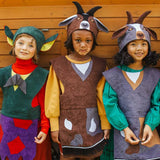 3 children standing in a row, two are wearing the billy goat hat and tabard and the third is wearing the troll hat and tabard.