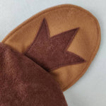 Ear on the brown bear hat.