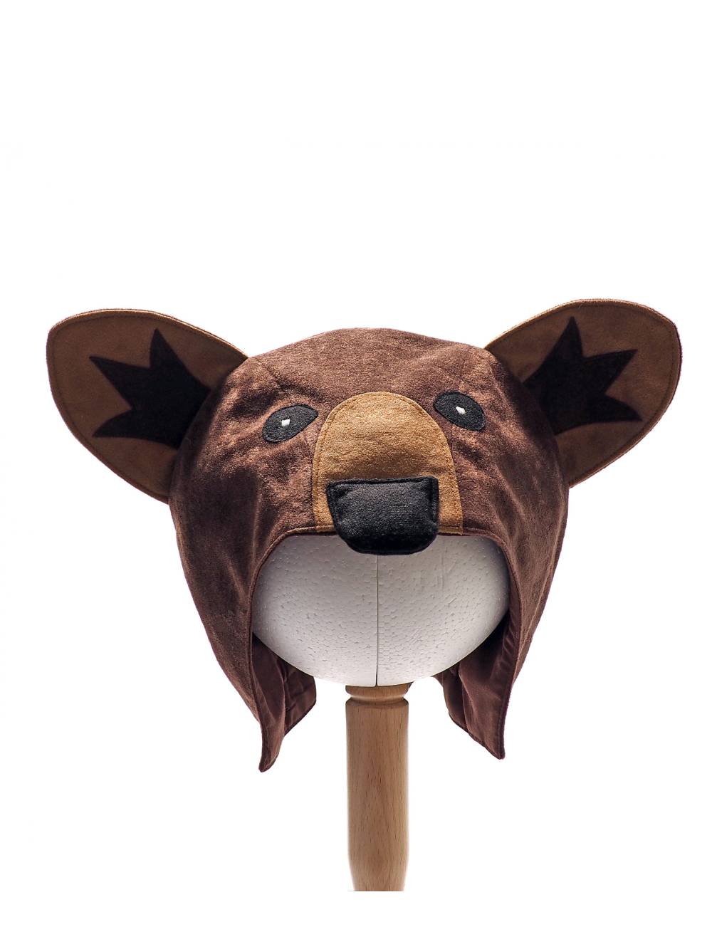 Front view of the brown bear hat on a stand against a plain white background.