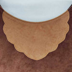 Applique detail on the front of the brown bear tabard.