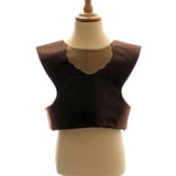 Front view of the brown bear tabard on a stand against a plain white background.