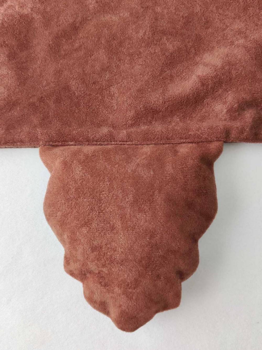 Tail on the brown bear tabard.