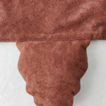 Tail on the brown bear tabard.