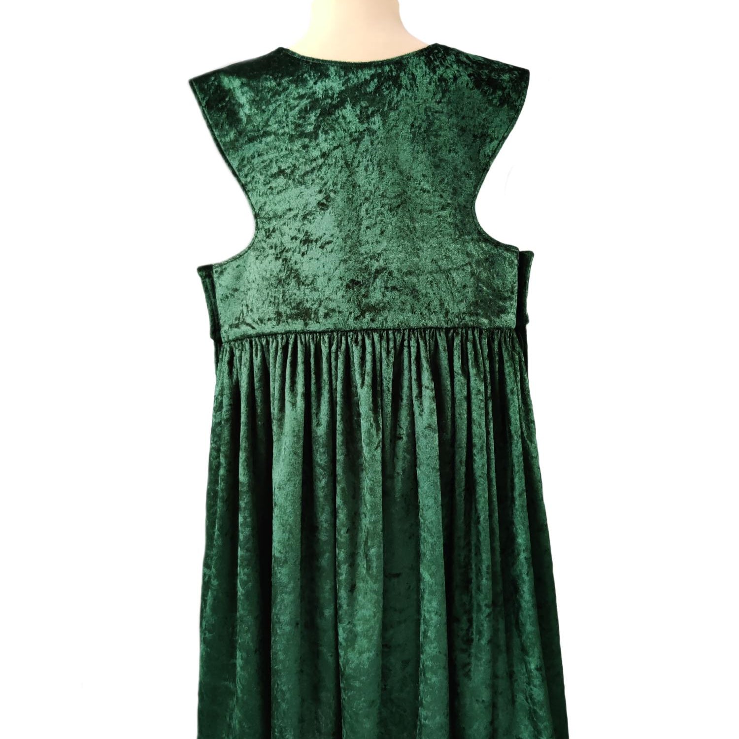 Back view of the emerald royal fairytale dress on a stand