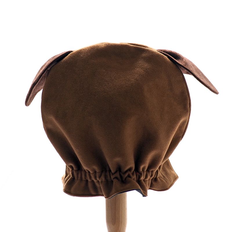 Back view of the floppy eared dog hat on a stand against a plain white background.