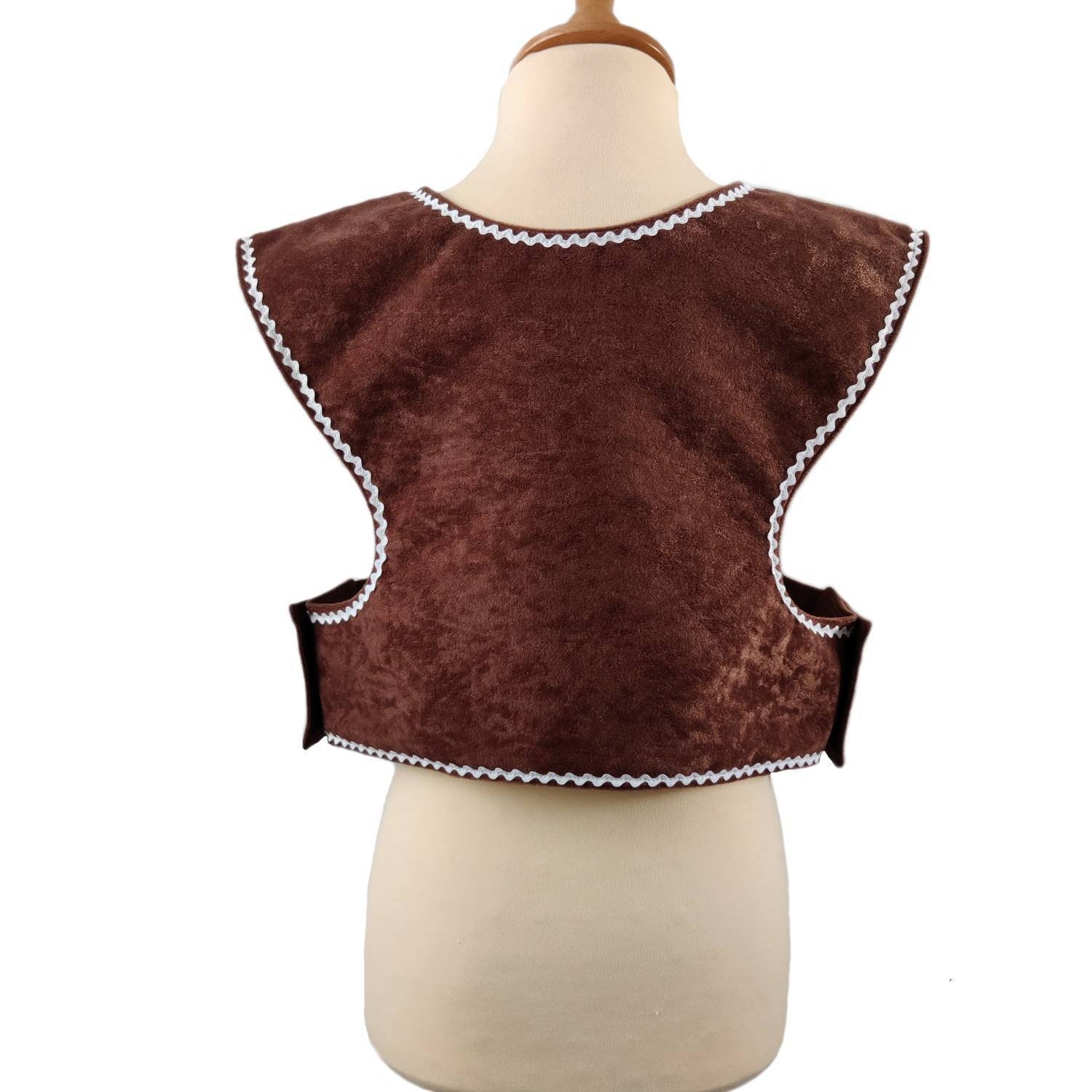 Back view of the gingerbread man tabard on a stand against a white background.