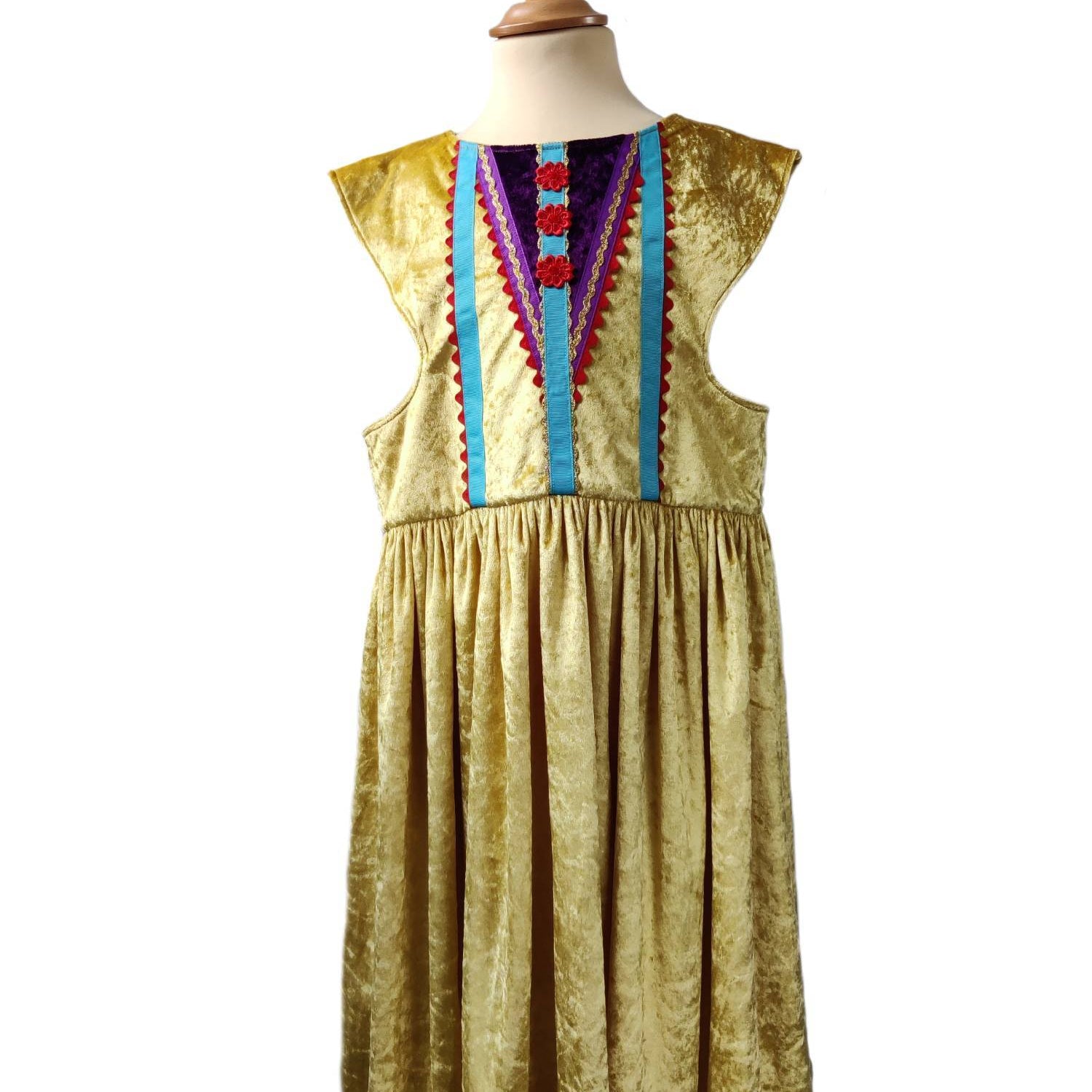 Front view of the gold royal fairytale dress on a stand