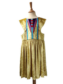 Front view of the gold royal fairytale dress on a stand