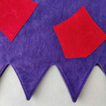 Close up of applique detail and zig zag edge of the green & purple troll tabard