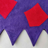 Close up of applique detail and zig zag edge of the green & purple troll tabard