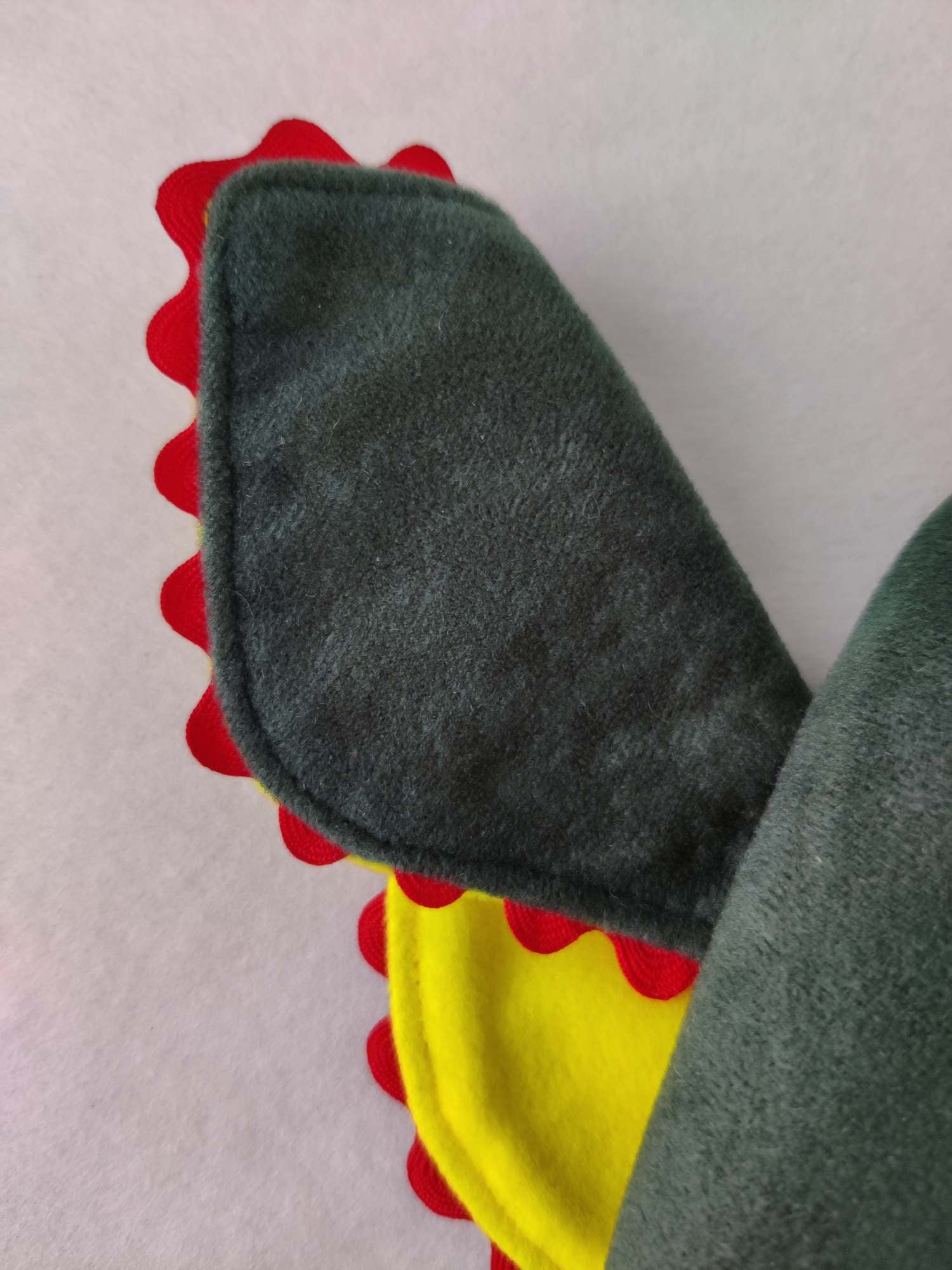 Close up of the front view of the ear on the green troll hat