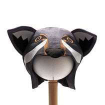 Front view of the grey wolf hat on a stand against a white background.