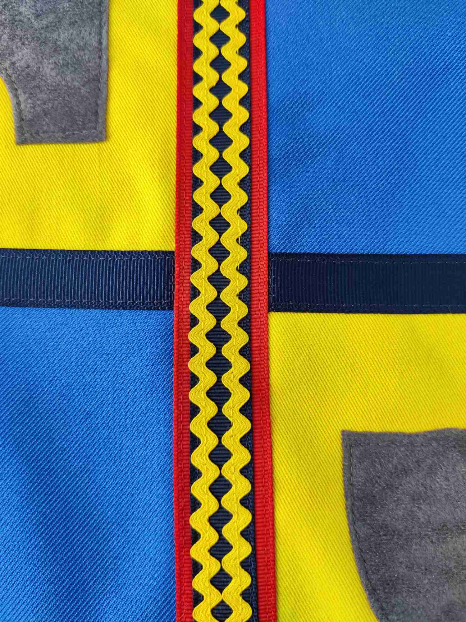 Close up of trimming decoration on the knight tabard