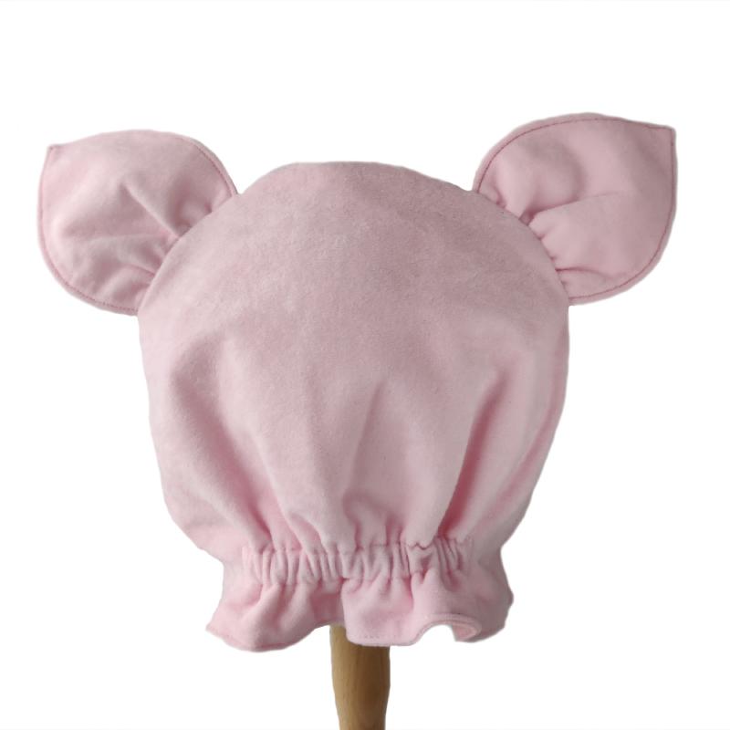 Back view of the pink pig hat on a stand.