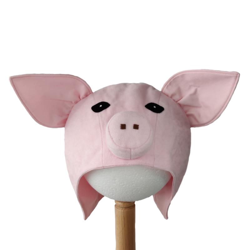 Front view of pink pig hat on a stand.