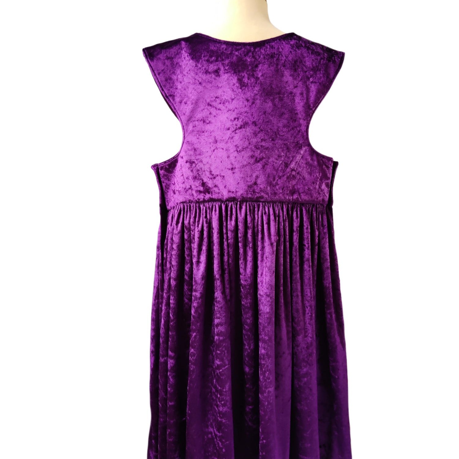Back view of the purple royal fairytale dress on a stand