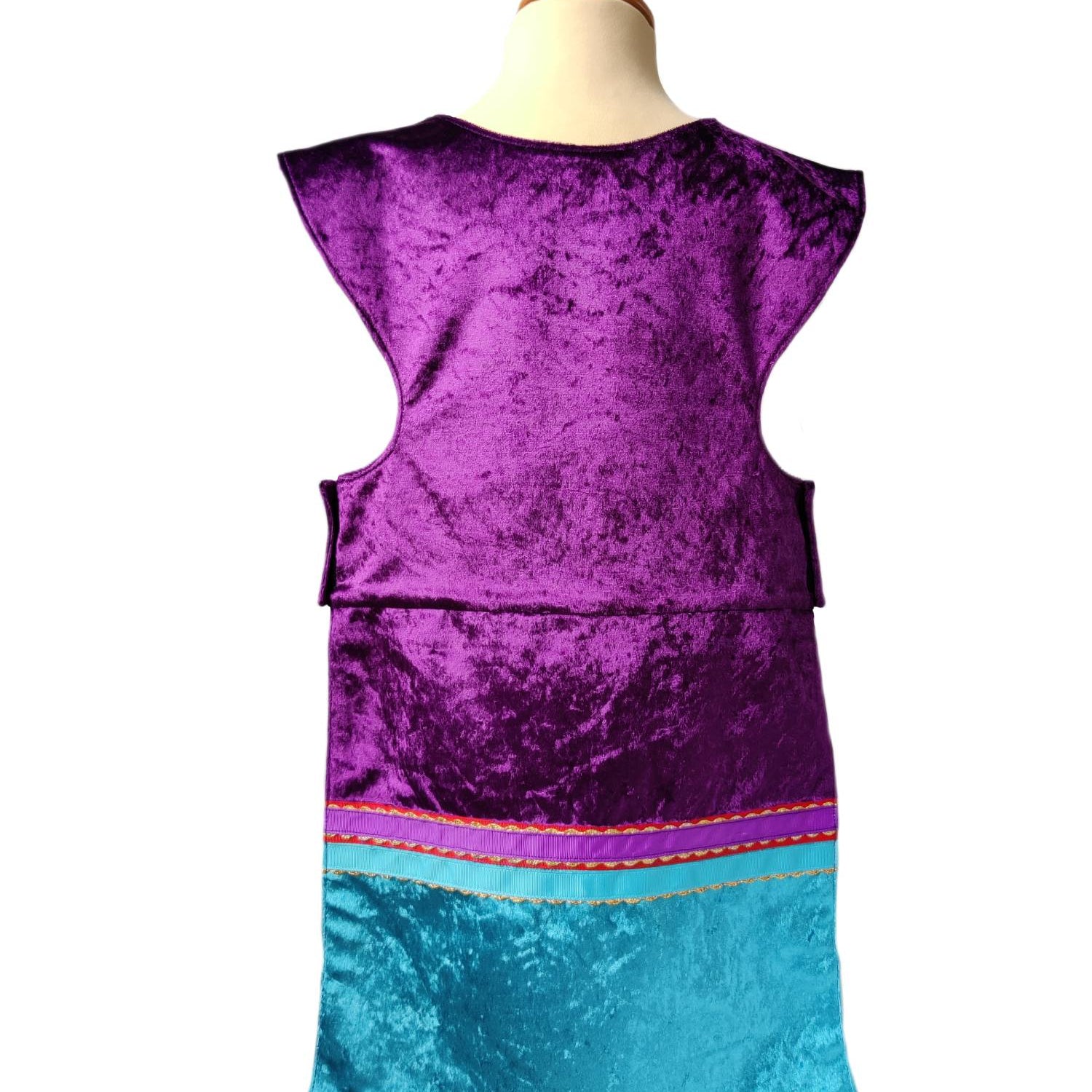 Back view of purple royal fairytale tabard on a stand
