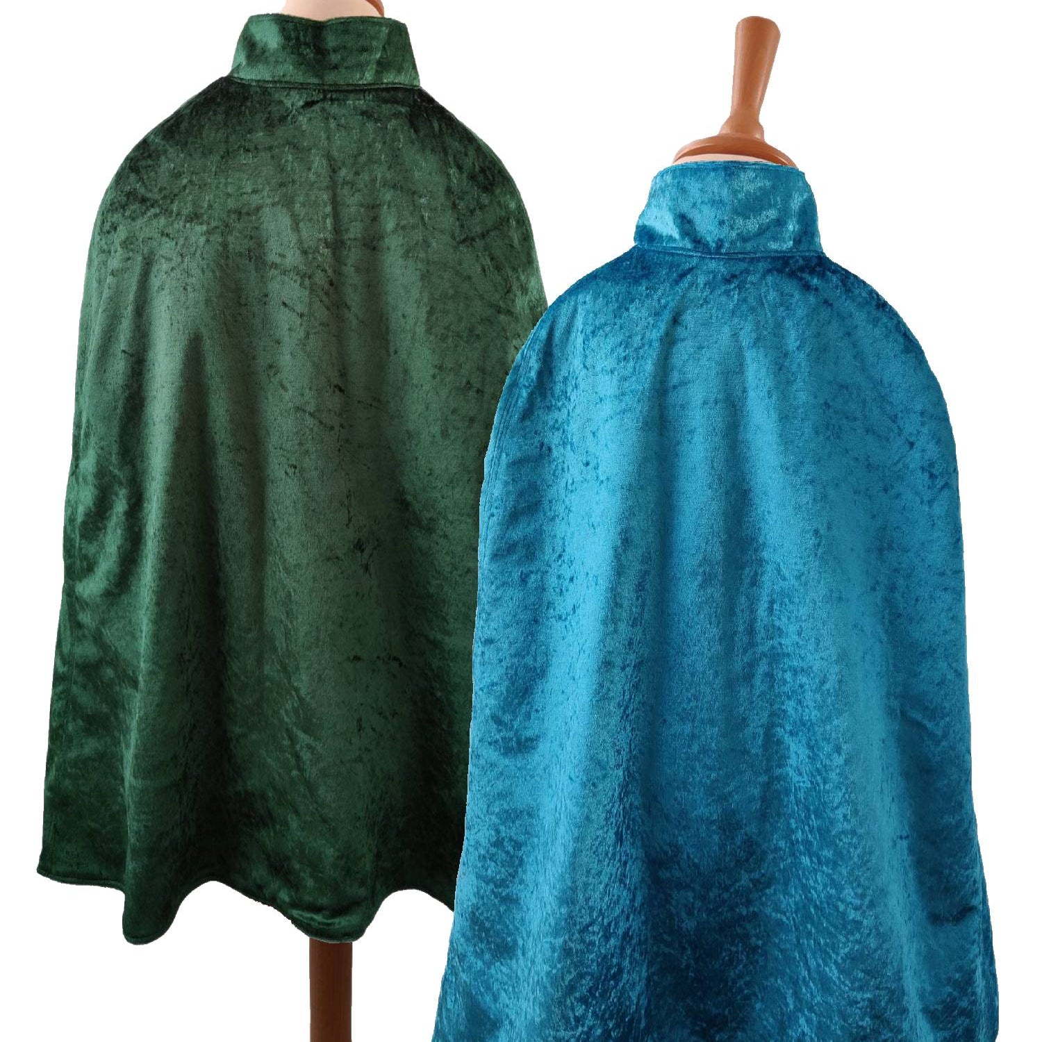 2 back view images of the turquoise side and emerald side of the reversible turquoise & emerald cape on stands