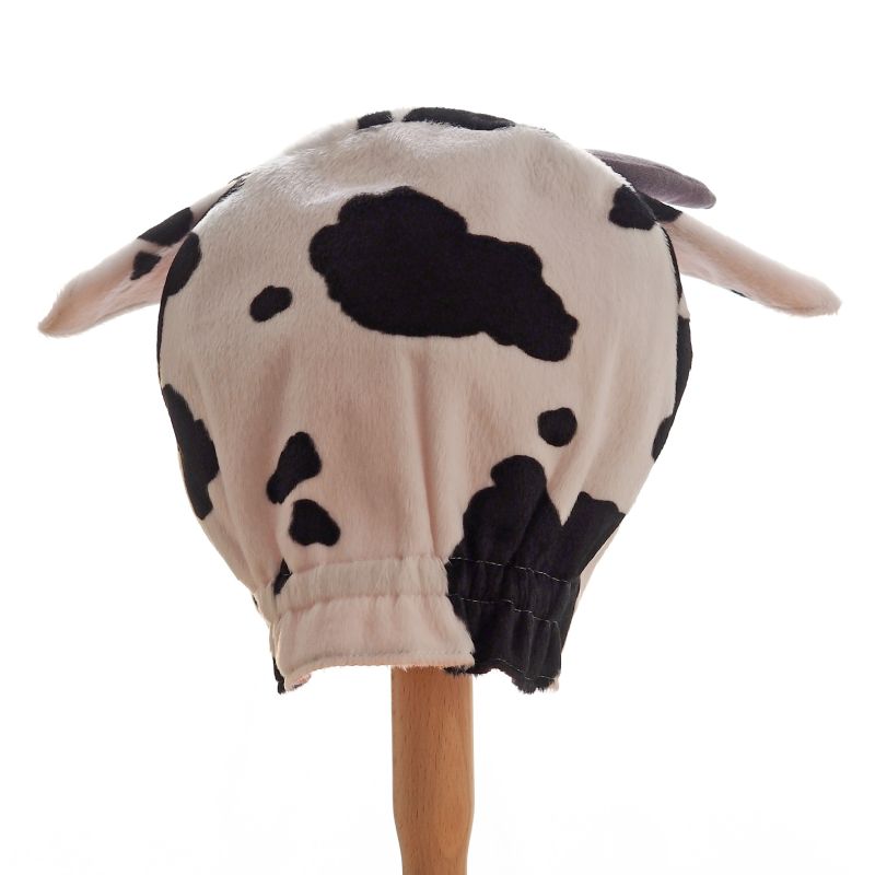 Back view of spotted cow hat on a stand against a white background.