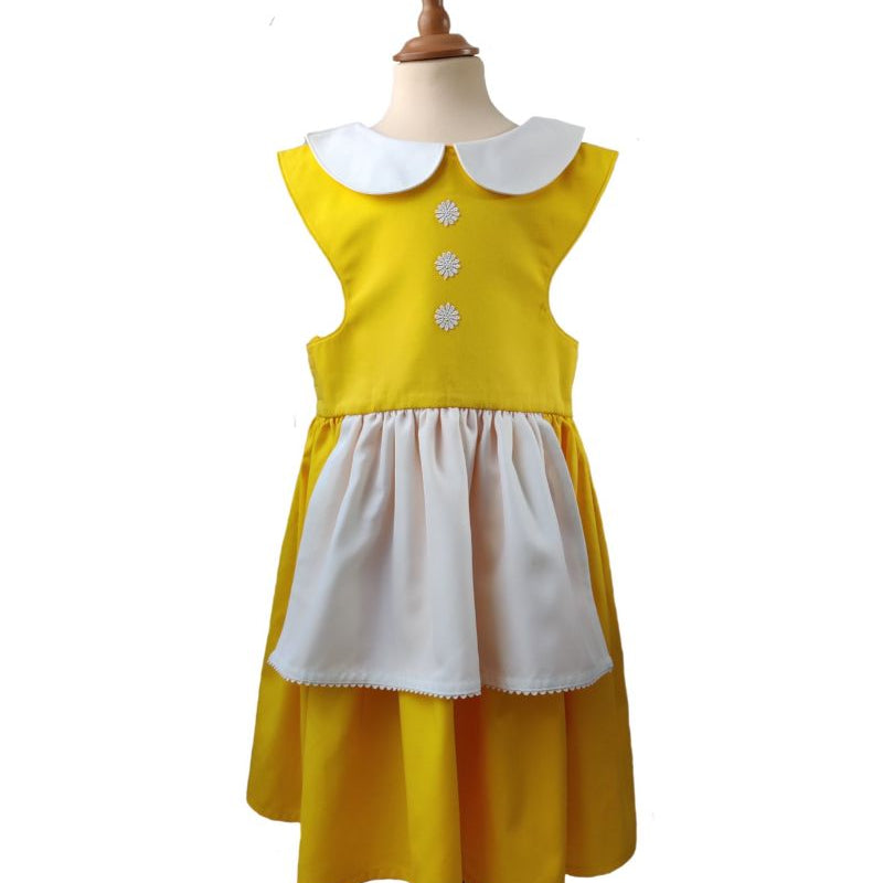 Front view of the sunshine yellow pinafore dress on a stand against a white background.