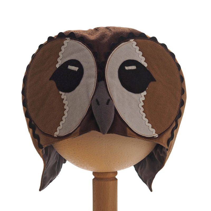 Front view of tawny owl hat on a stand against a white background.