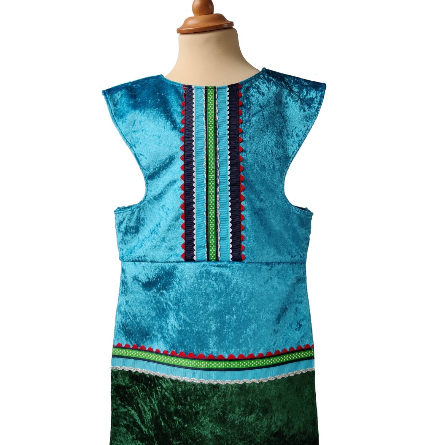 Front view of the turquoise royal fairytale tabard on a stand