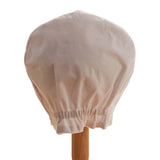 Back view of white duck hat on a stand against white background.