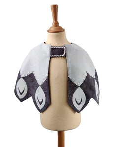 Front view of white feathered bird cape on a stand against white background.