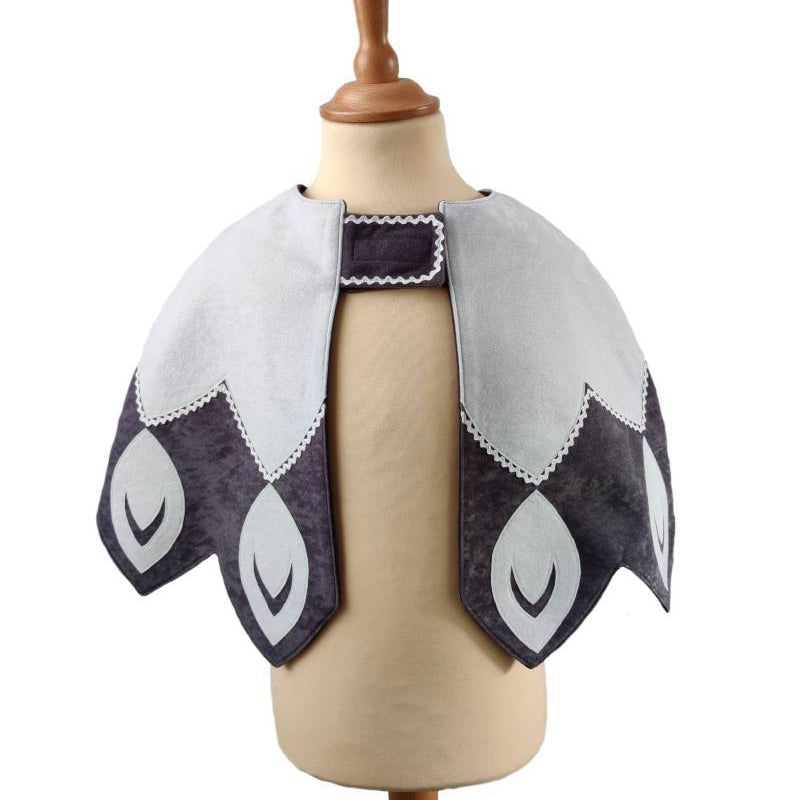 Front view of white feathered bird cape on a stand against white background.