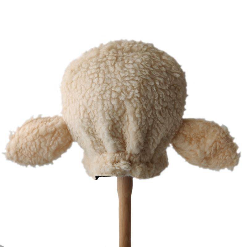 Back view of the woolly sheep hat on a stand against a white background.