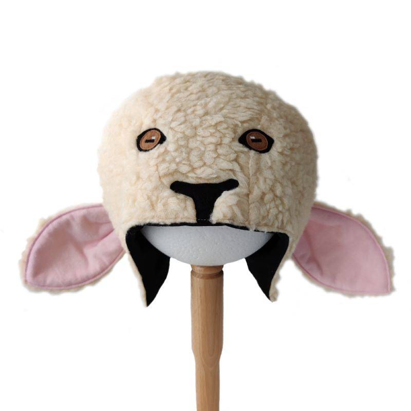 Front view of the woolly sheep hat on a stand against a white background.