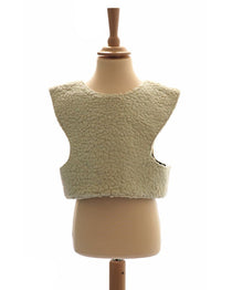 Front view of the woolly sheep tabard on a stand against a white background.